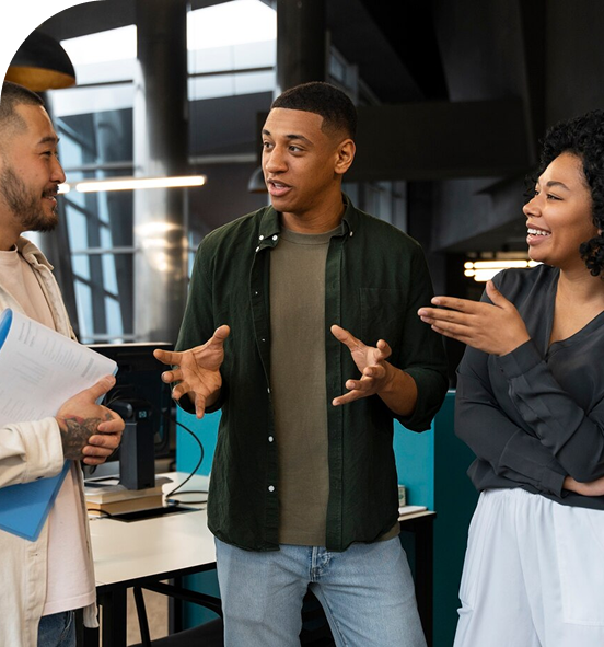 Three diverse professionals collaborating in modern office environment